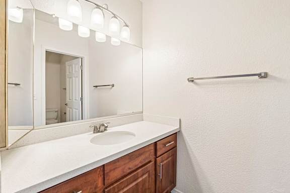 Apartment bathroom — representative home at The Palms.