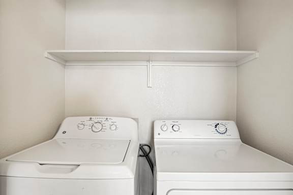 In-home laundry area — representative home at The Palms.