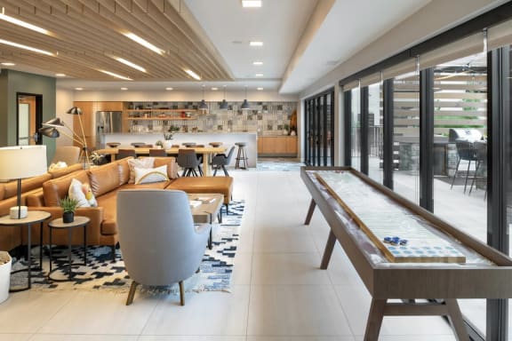 a lounge area with couches chairs and a table