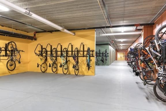 the bike rack at the top of the building is filled with bikes