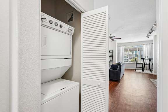A white oven and dishwasher in a kitchen.
