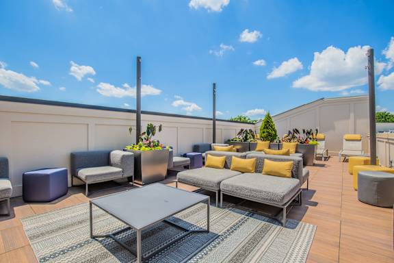 A patio with a table and chairs.