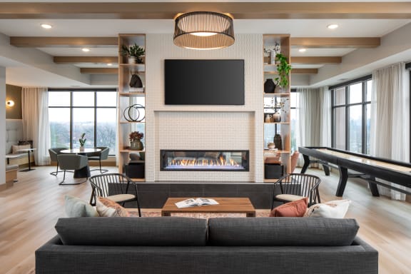 a living room with a fireplace and a television