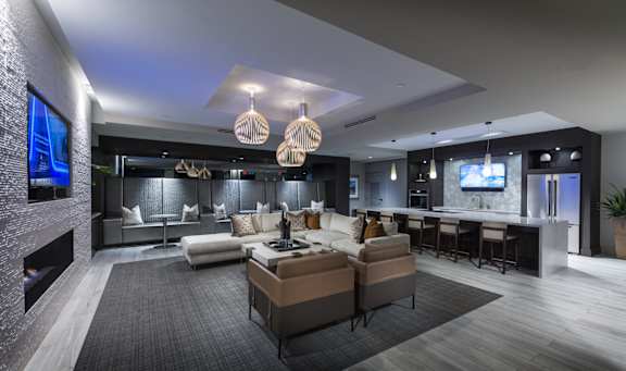 A modern living room with a fireplace and a large TV.