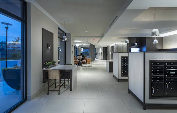 A modern kitchen with a dining table and chairs.