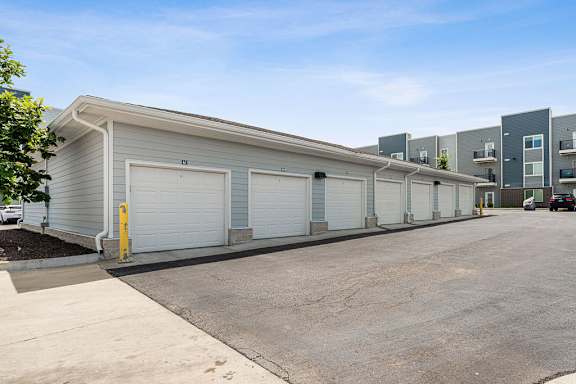 A row of garages with a clear blue sky above.