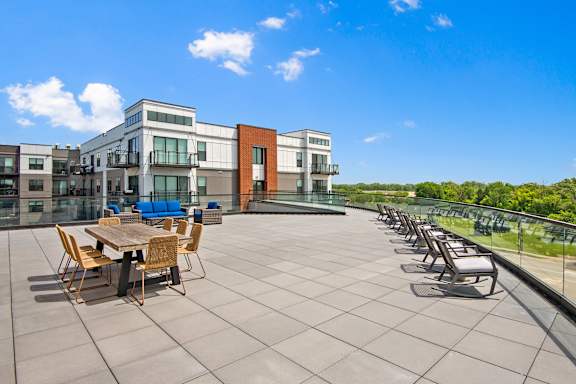 A sunny day at the rooftop patio with a table set for six.