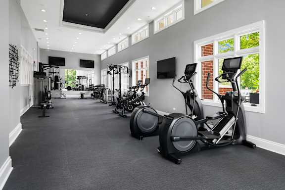 A spacious gym with a variety of exercise equipment.