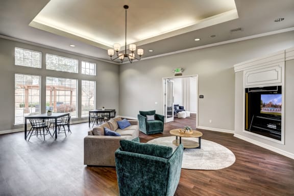 Sonoma Resort at Saddle Rock - Clubhouse With Large Windows, Plank Flooring, Living Room Furniture, and Built-In Flat Screen TV