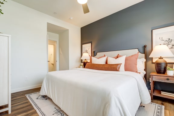 a bedroom with a bed and a nightstand