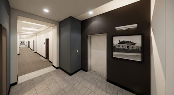 A long hallway with doors on both sides and a picture on the wall.