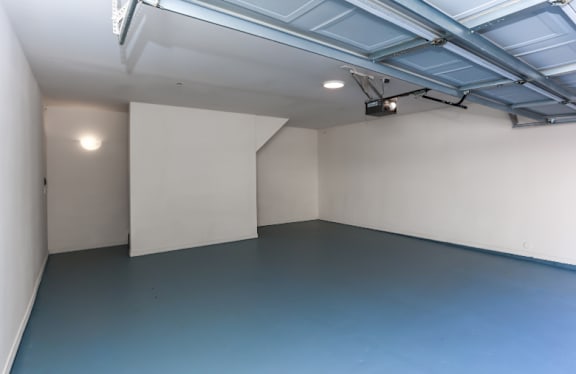 A room with a blue floor and white walls.