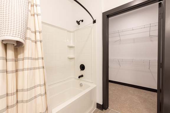 a bathroom with a shower and a bathtub