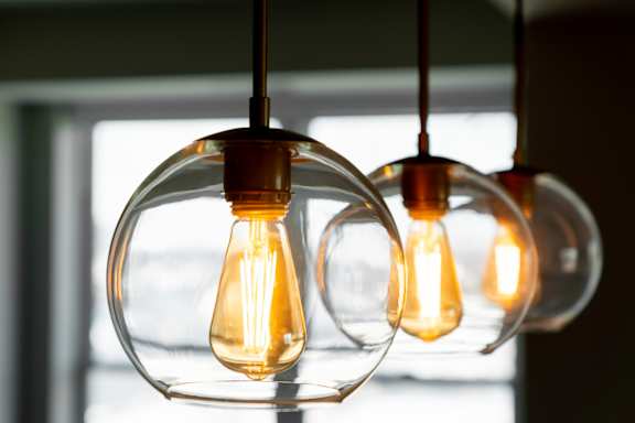 Three hanging light bulbs are illuminated.