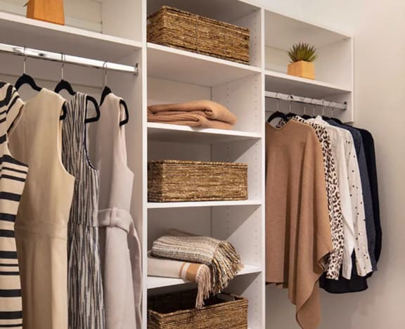 Stunning Walk In Closet with Pristinely Organized Clothing at North&#x2B;Vine in Chicago, Illinois