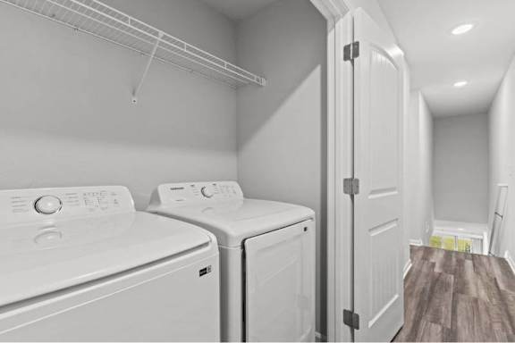 A laundry room with a washer and dryer.