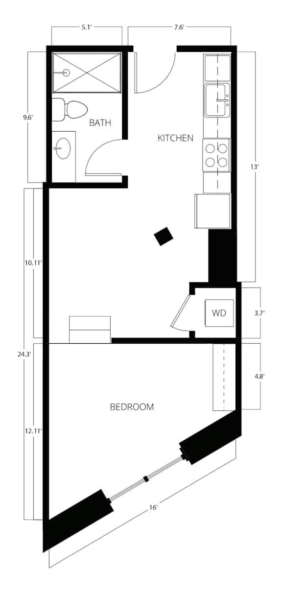 A floor plan of a small apartment with a bedroom, kitchen, and bathroom.