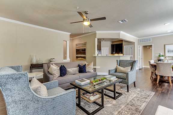 a living room with couches and chairs and a coffee table