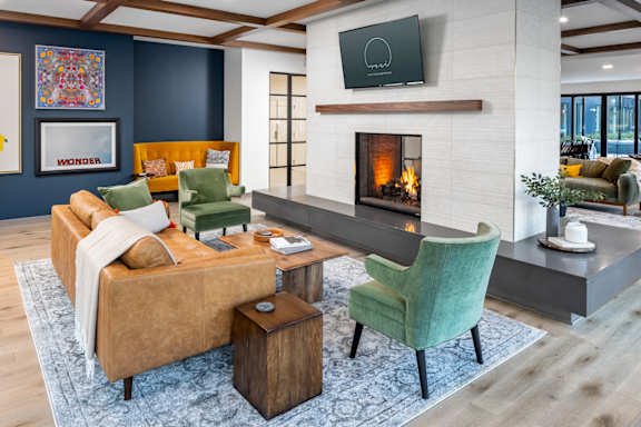 A modern living room with a fireplace and a television.