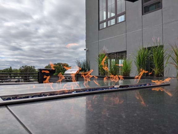 Tabletop Fireplace on Rooftop Patio  at Dillard Apartments, Fargo, ND 58102