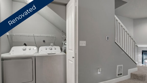 a laundry room with a washer and dryer