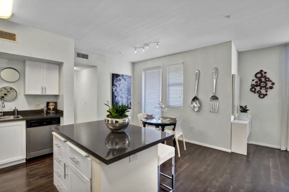 a kitchen and dining area in a 555 waverly unit
