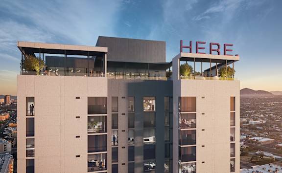 a rendering of a tall building on a city street