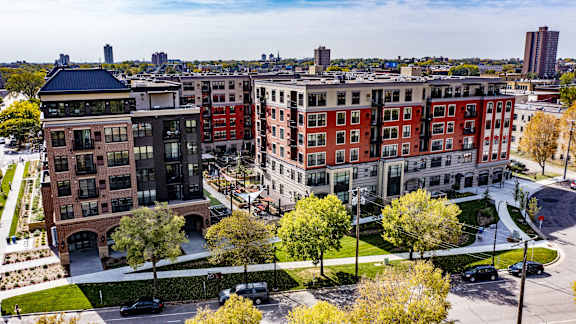 an aerial view of several apartment buildings in the city