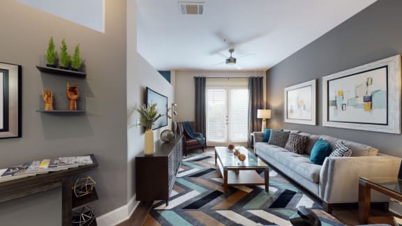 a living room with grey walls and a white couch