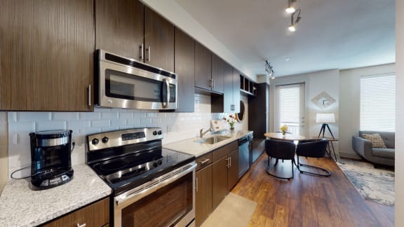 a kitchen and dining area in a 555 waverly unit