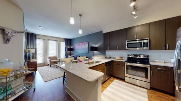 a kitchen and living room in a 555 waverly unit