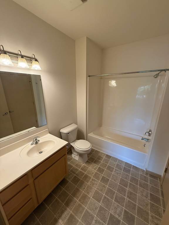 A bathroom with a sink, toilet, and bathtub.