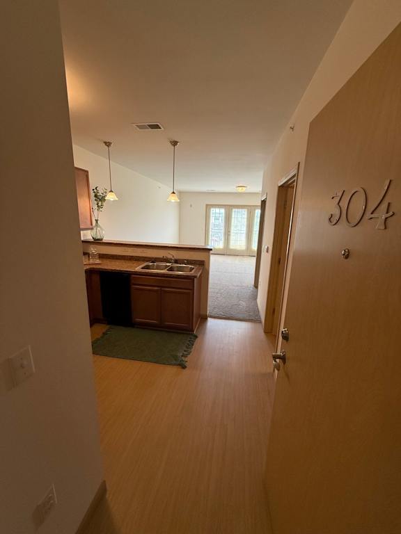 A hallway with a door numbered 304 on the right.