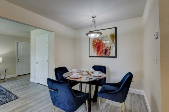 a dining room with a table and chairs