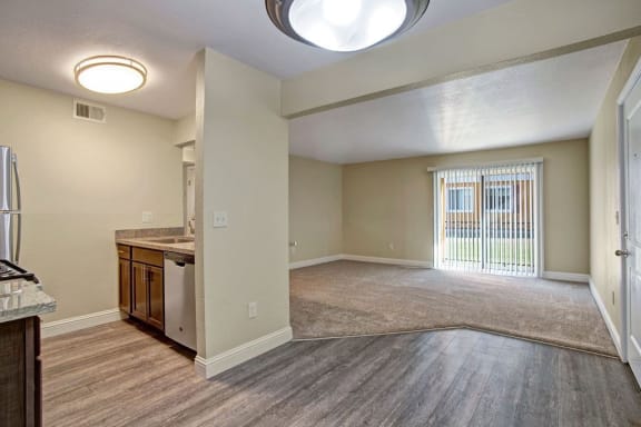 a kitchen and living room with a large window