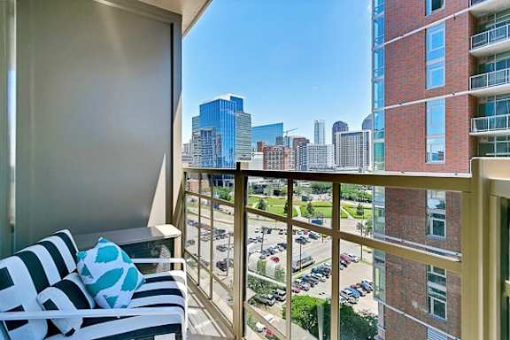 a balcony with a view of a city
