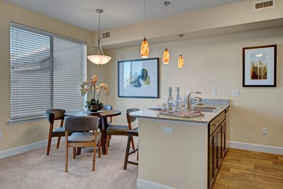 a kitchen and dining area with a large window