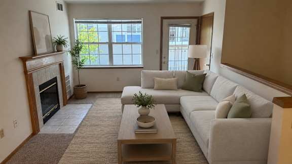 A living room with a fireplace and a couch.