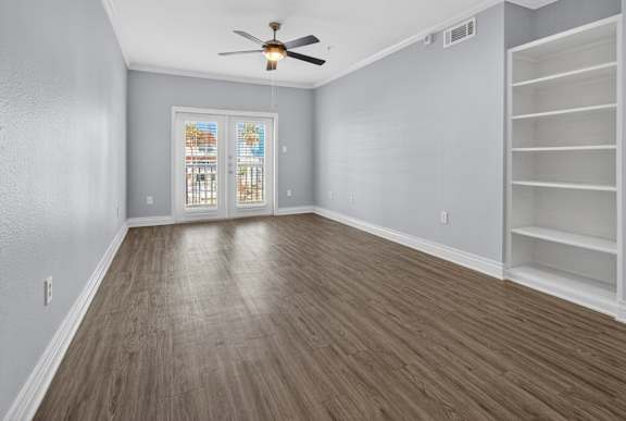 A room with a ceiling fan and a window with blinds.