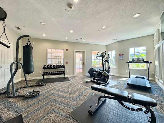 A well-equipped gym with a variety of exercise equipment.