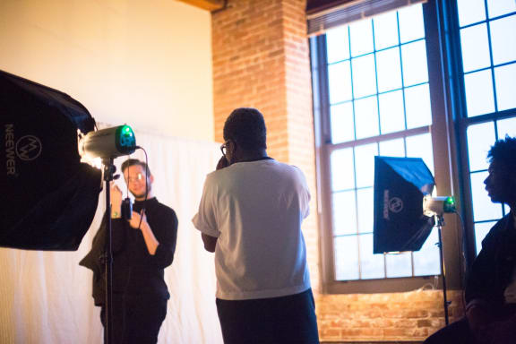 people standing in front of a camera in a room