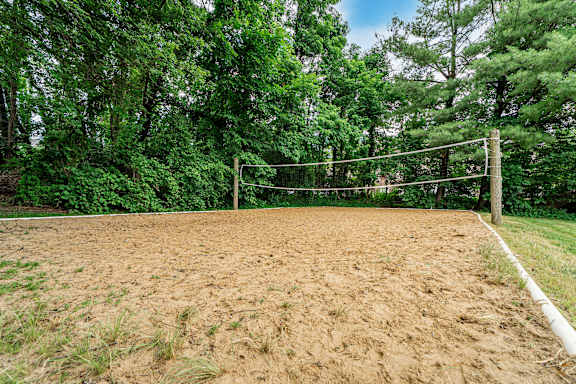 A sandy volleyball court at Hunt Club Apartments, Ohio, 44321