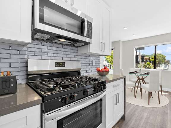 A modern kitchen with a black and white color scheme.