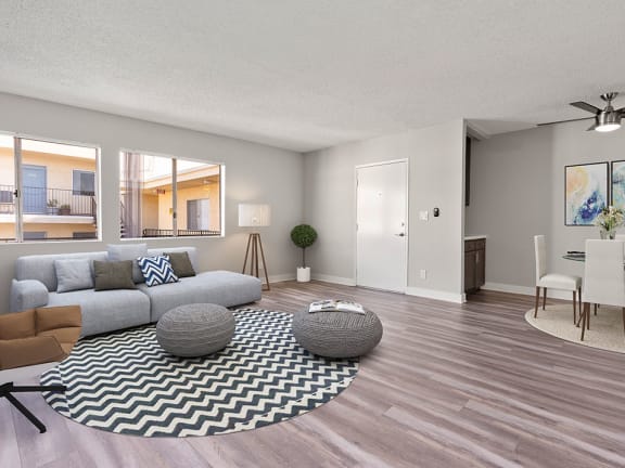 Living room with hardwood floor and view of dining area.