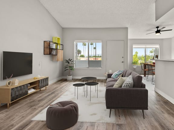 Hardwood floored living room With stone walled fireplace.