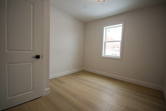 A room with a door and a window.