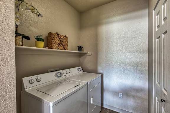 A stainless steel oven and microwave in a kitchen.