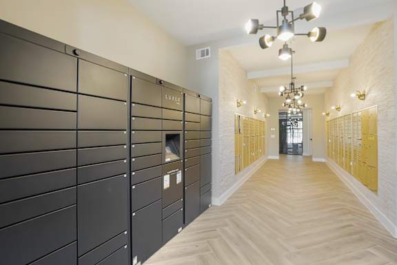 a row of lockers in a hallway with a wood floor