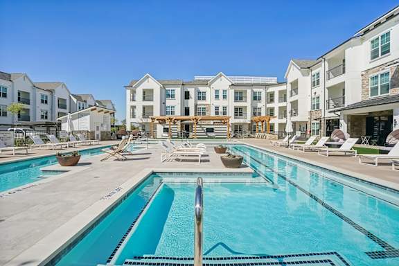 our apartments have a large swimming pool with lounge chairs