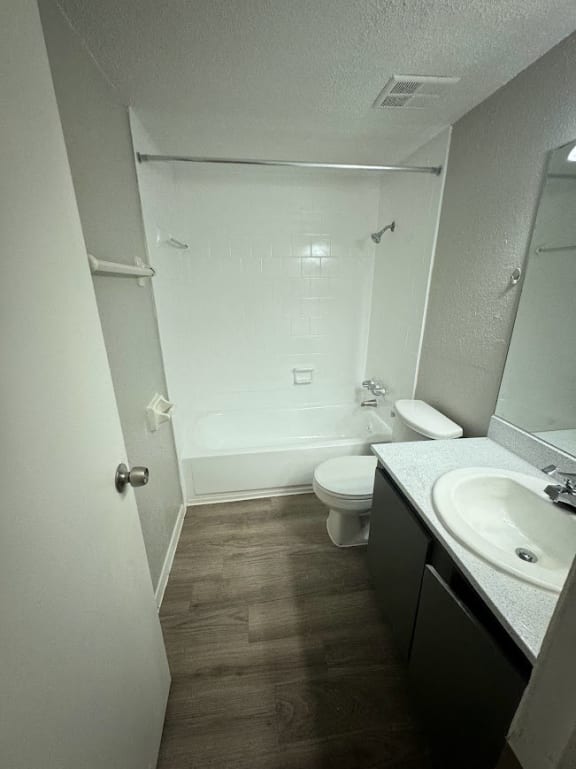 a small bathroom with a sink toilet and shower